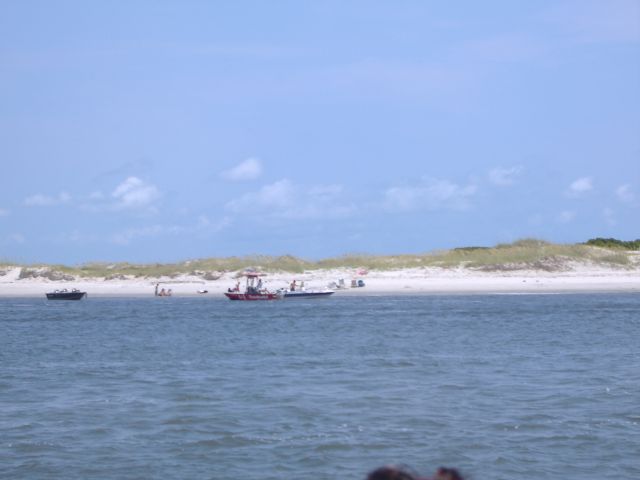 a few fishermen and some who are swimming.jpg